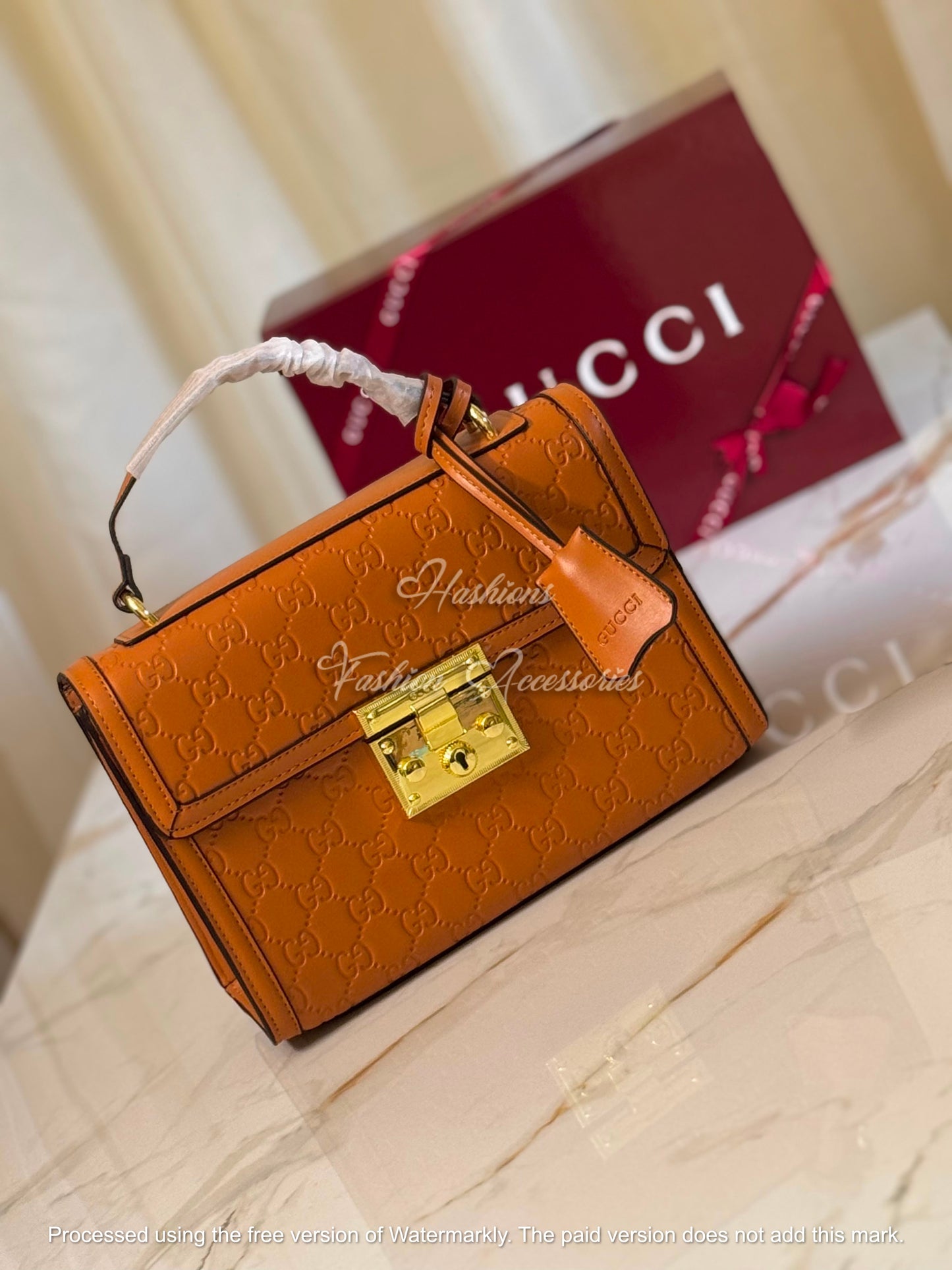 Monogram Embossed Leather Top-Handle Bag