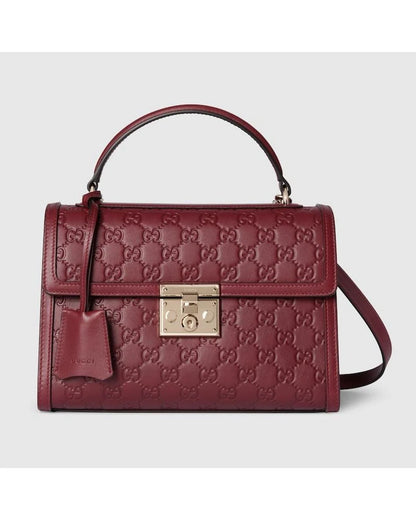 Monogram Embossed Leather Top-Handle Bag