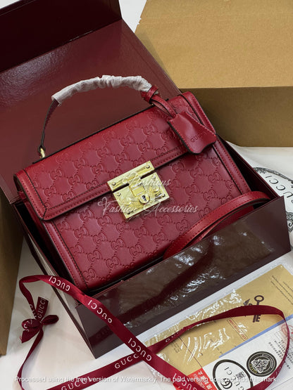 Monogram Embossed Leather Top-Handle Bag
