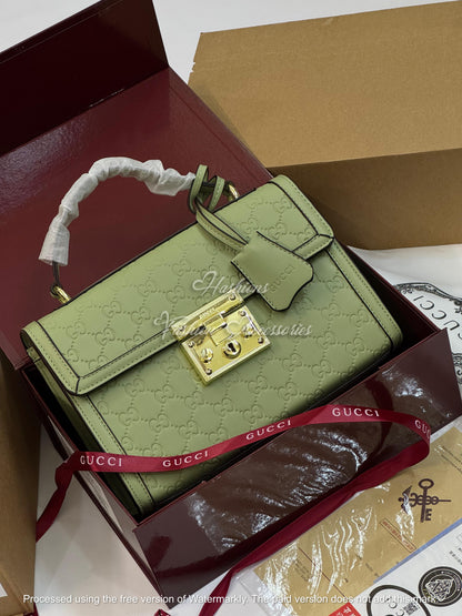 Monogram Embossed Leather Top-Handle Bag