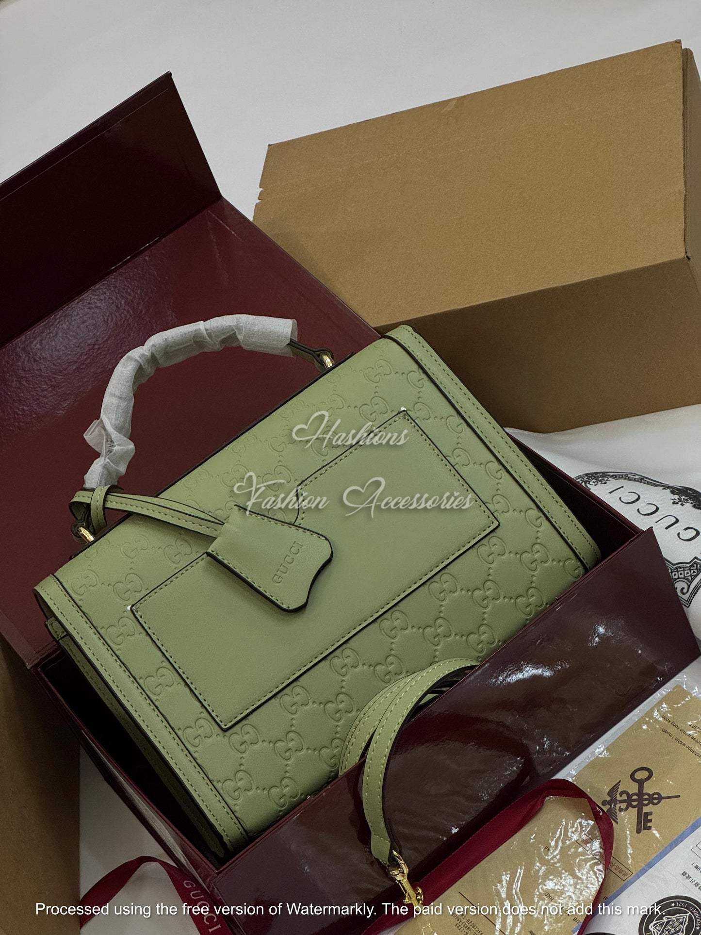 Monogram Embossed Leather Top-Handle Bag