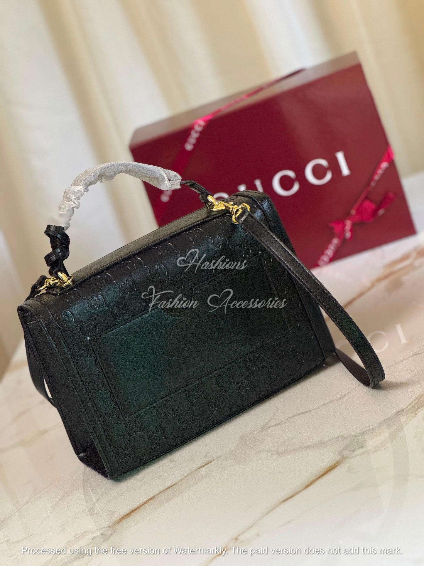 Monogram Embossed Leather Top-Handle Bag