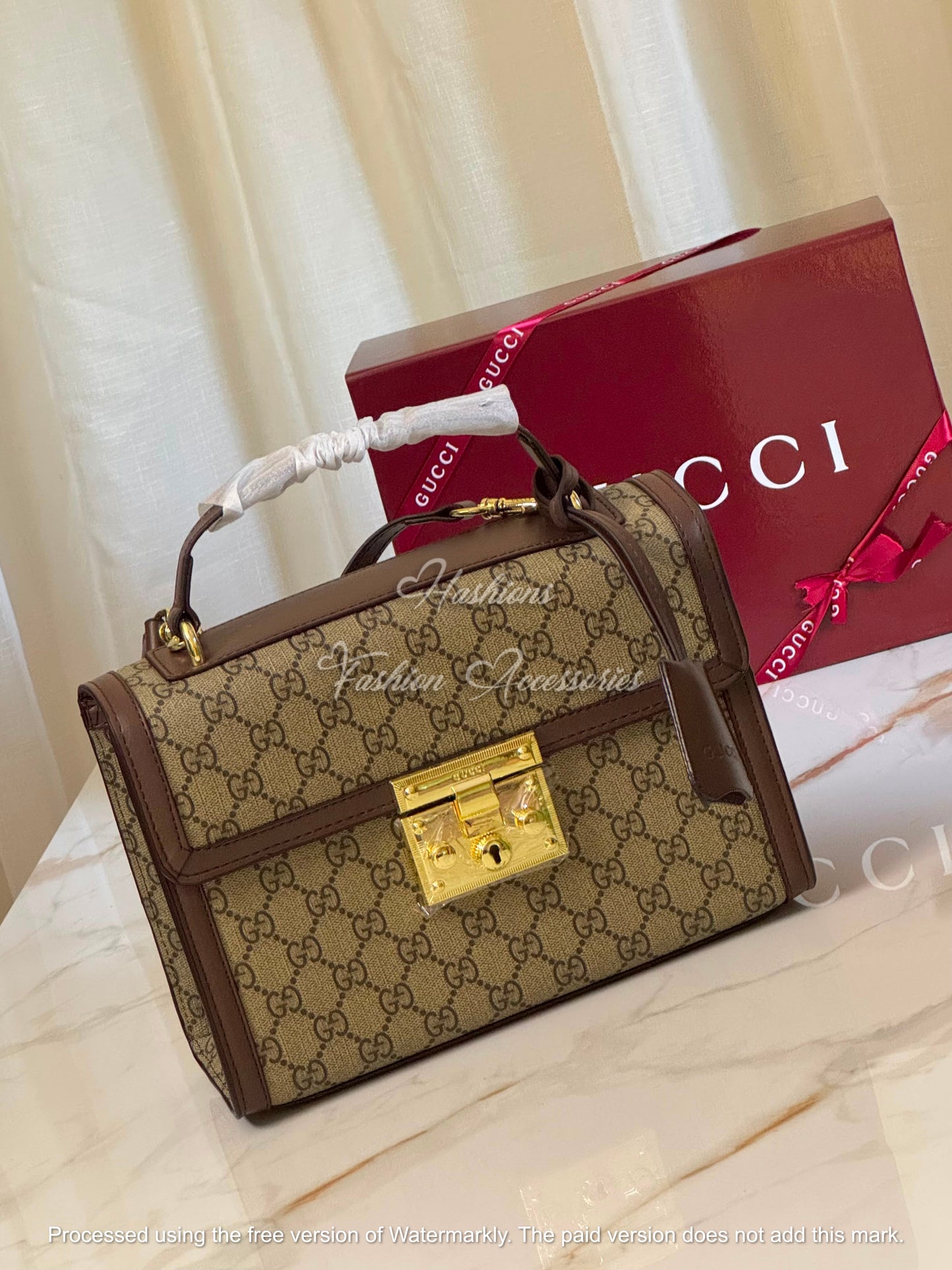 Monogram Embossed Leather Top-Handle Bag