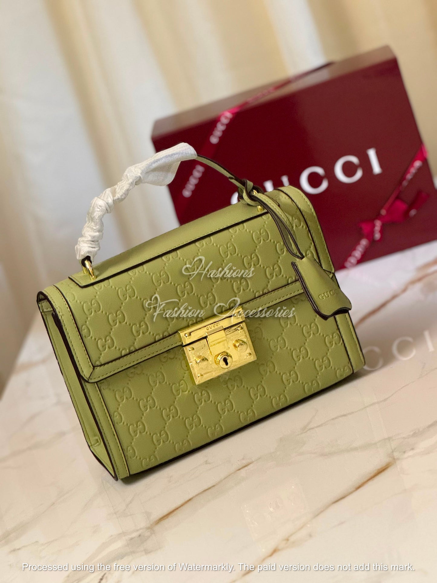 Monogram Embossed Leather Top-Handle Bag