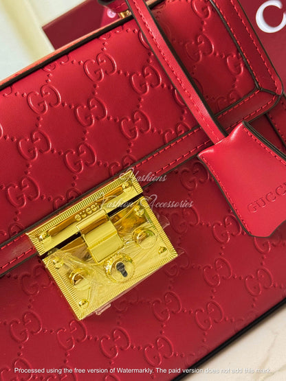 Monogram Embossed Leather Top-Handle Bag