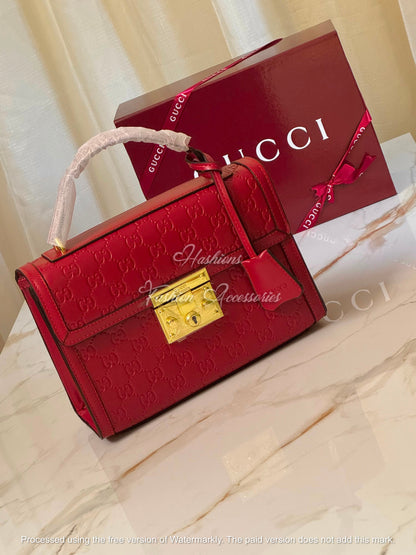 Monogram Embossed Leather Top-Handle Bag
