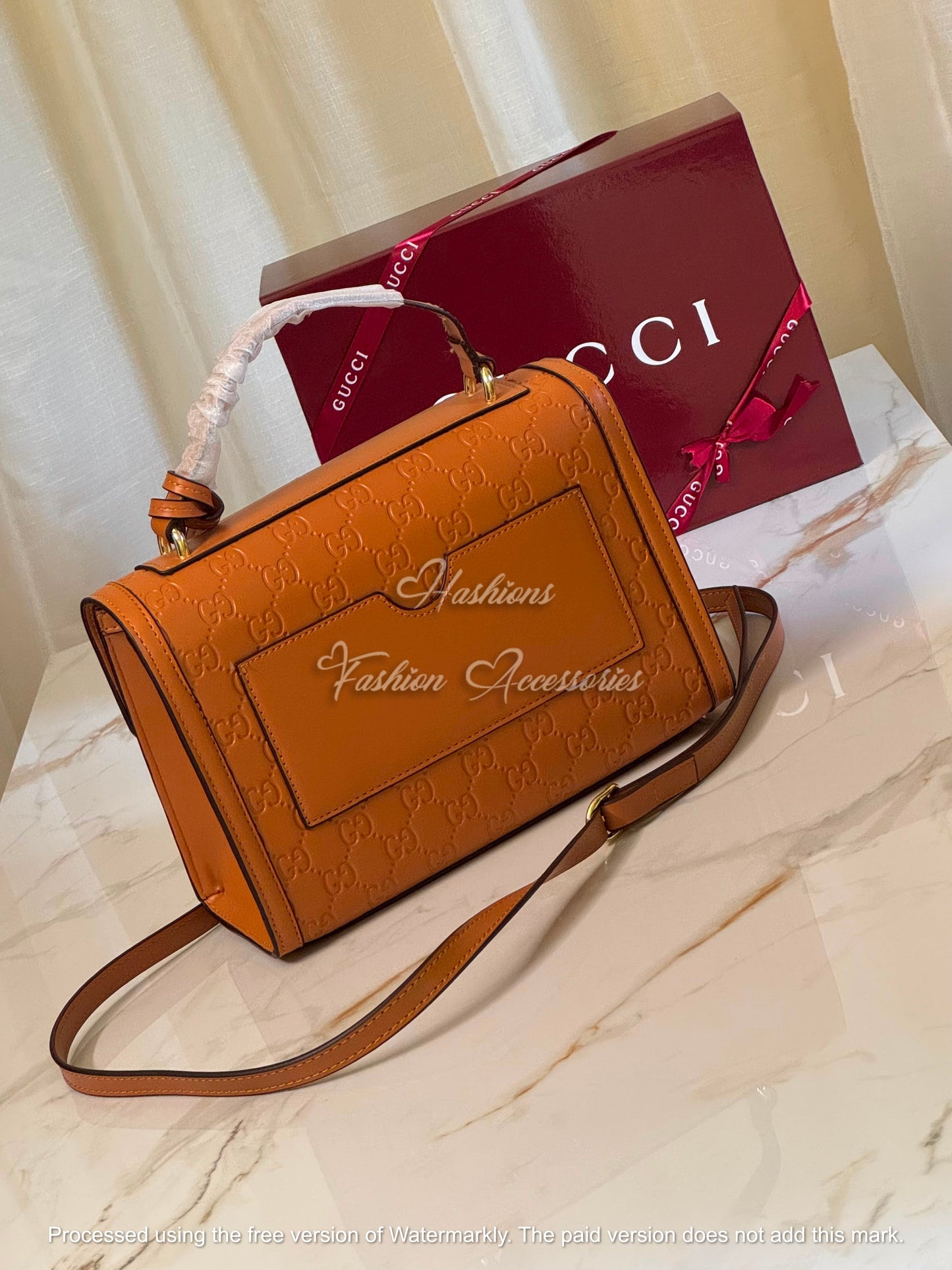 Monogram Embossed Leather Top-Handle Bag