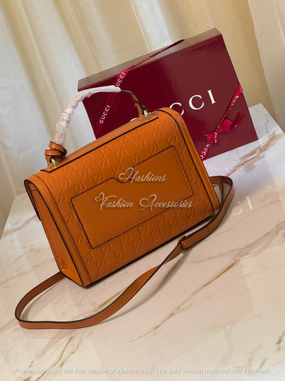 Monogram Embossed Leather Top-Handle Bag
