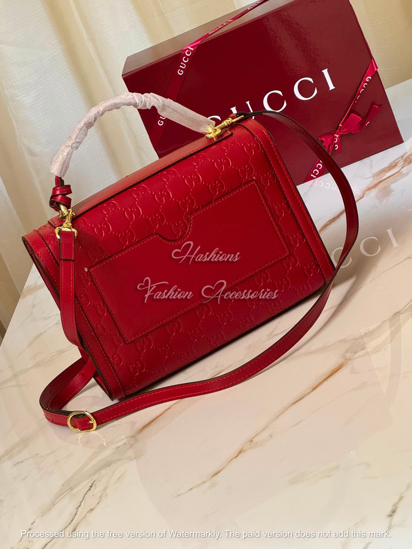 Monogram Embossed Leather Top-Handle Bag