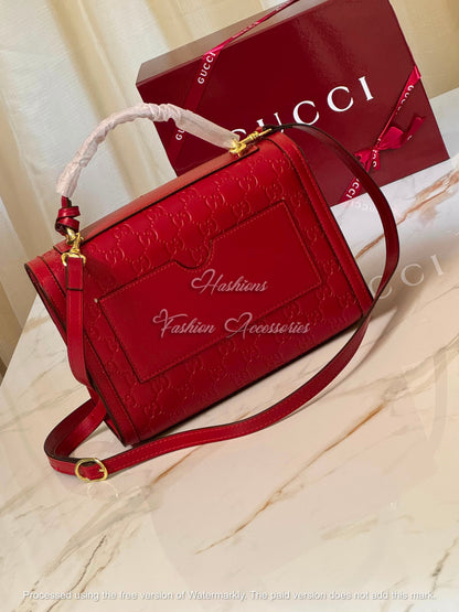 Monogram Embossed Leather Top-Handle Bag