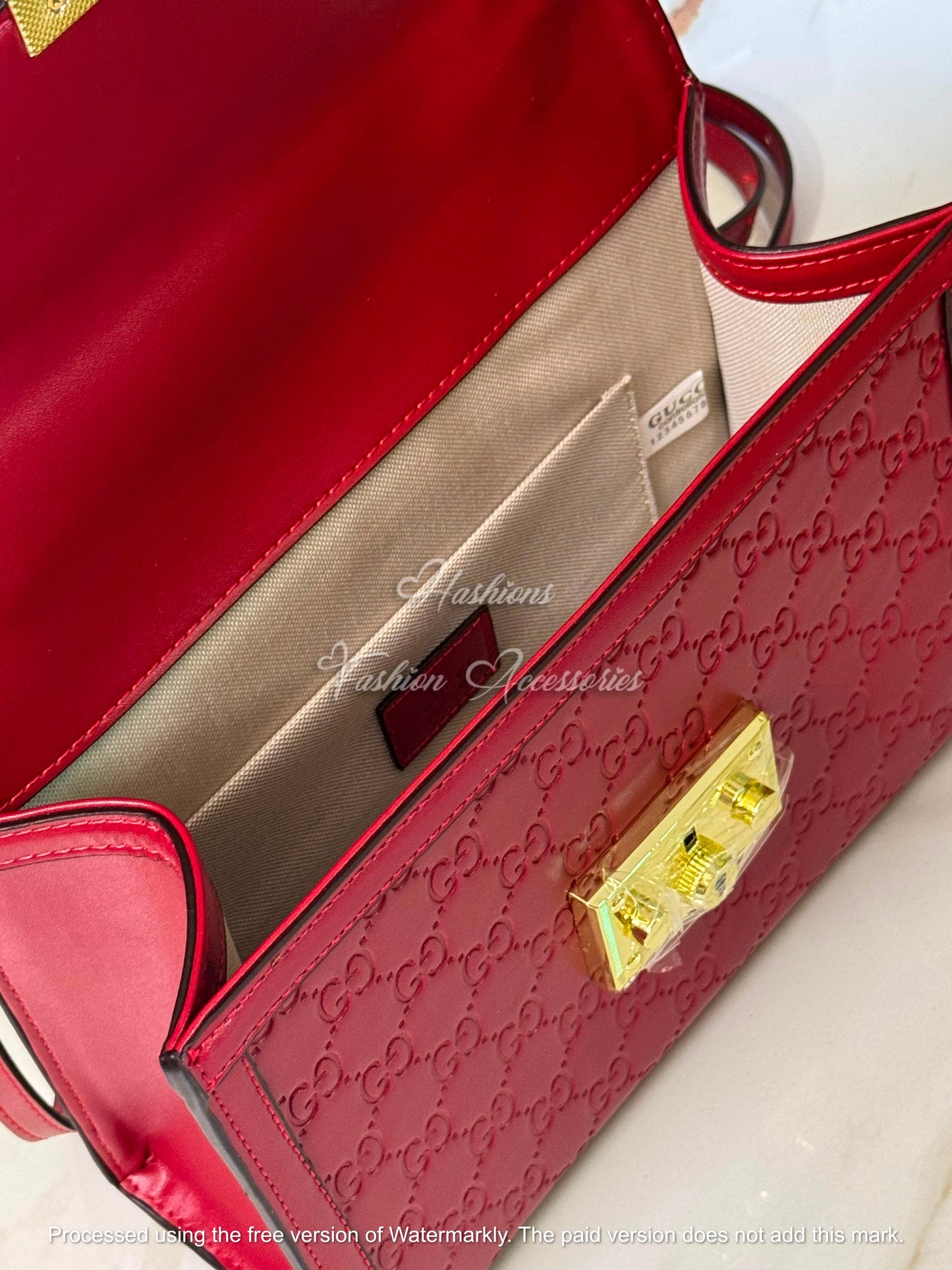 Monogram Embossed Leather Top-Handle Bag