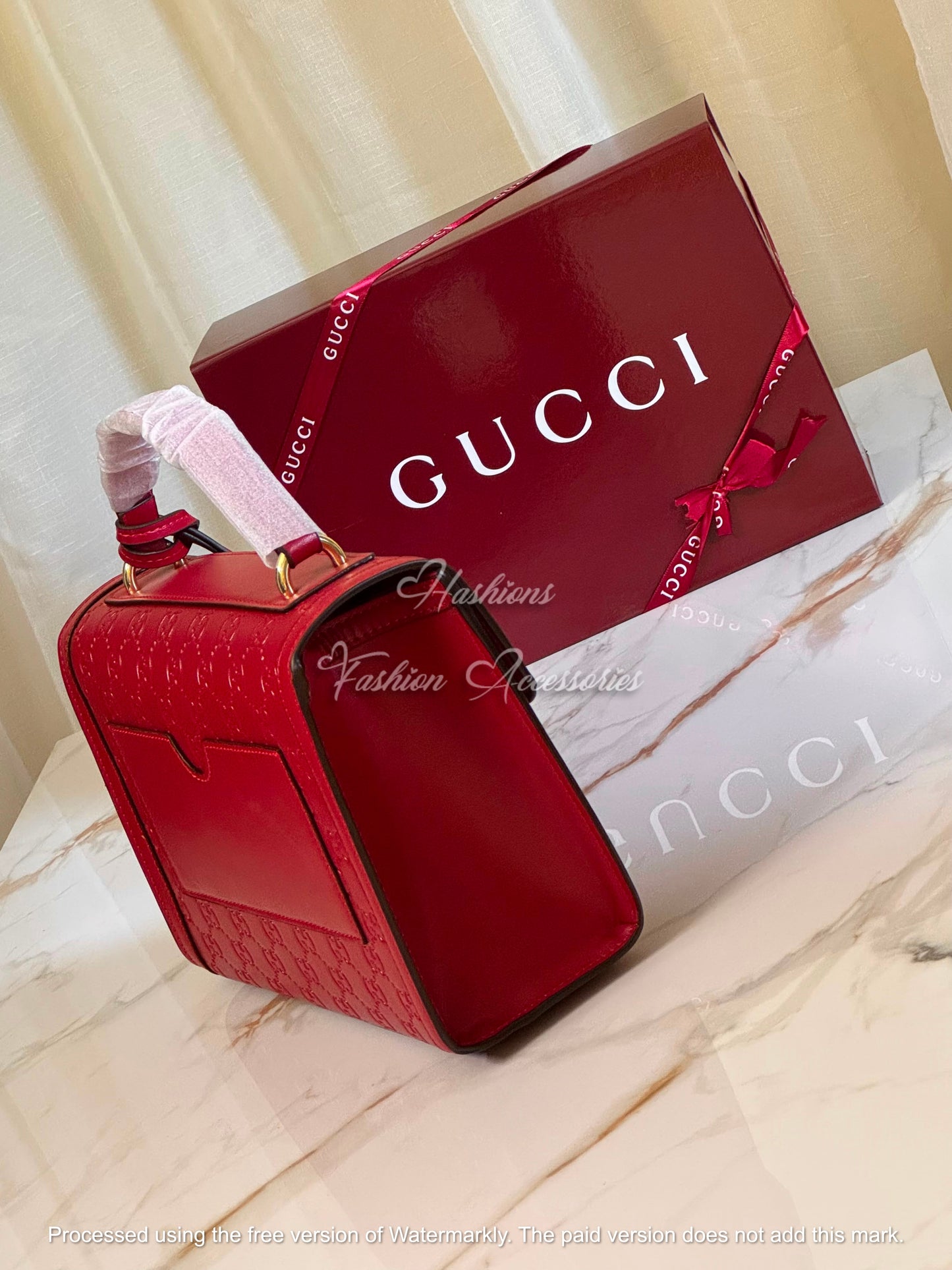Monogram Embossed Leather Top-Handle Bag
